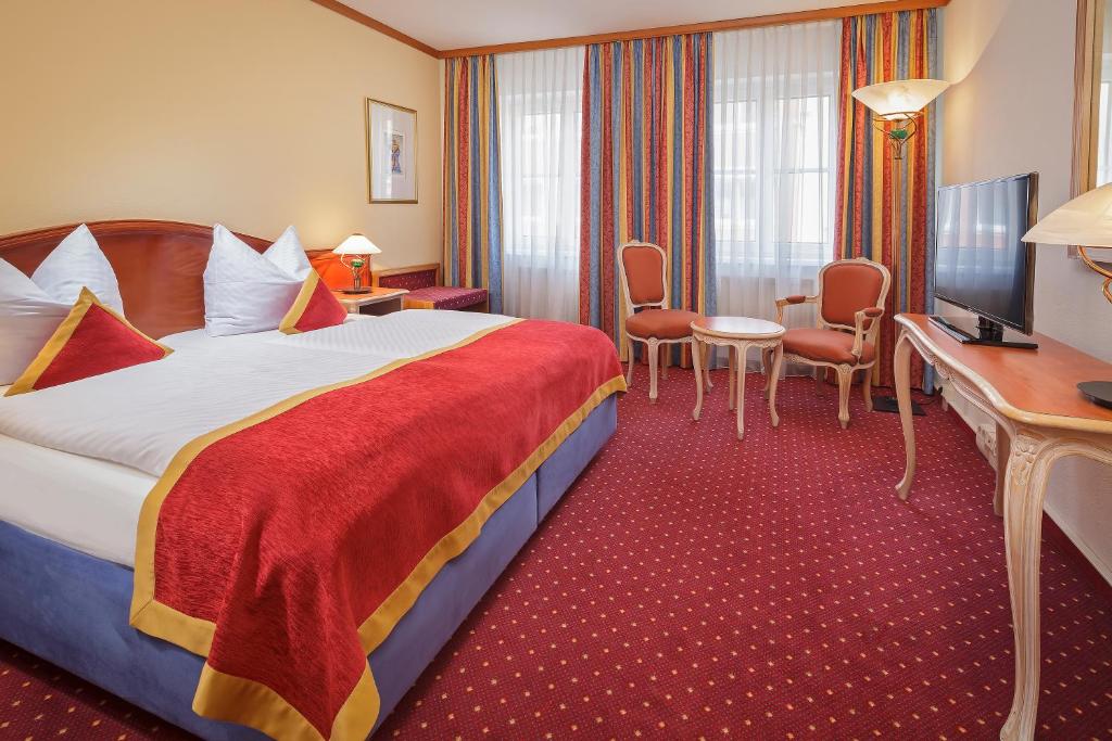 Postel nebo postele na pokoji v ubytování Luitpoldpark-Hotel