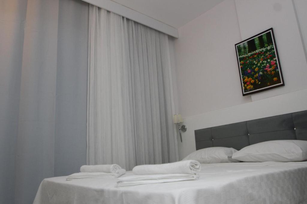 A bed or beds in a room at LİMAN BOUTIQUE OTEL