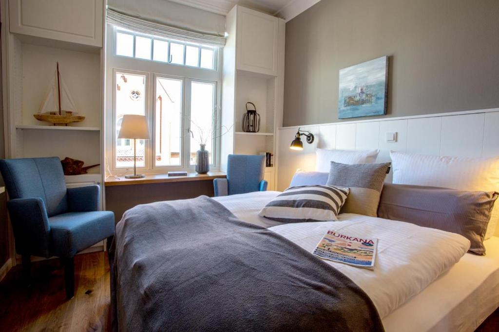 En eller flere senge i et værelse på Logierhaus K15 Appartement 7