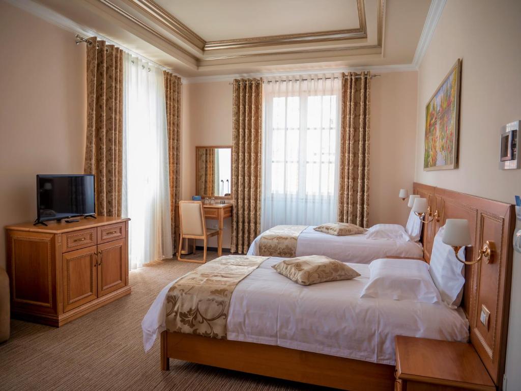 Postel nebo postele na pokoji v ubytování Hotel Boka