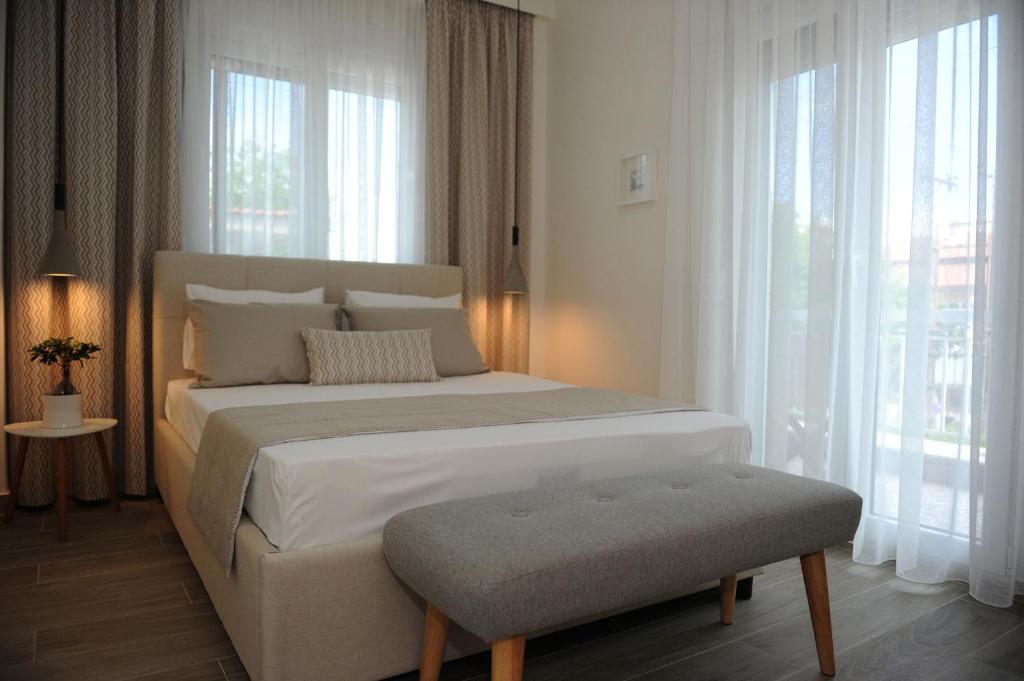 Łóżko lub łóżka w pokoju w obiekcie Stamatia Apartments