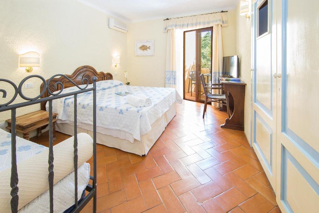 Postel nebo postele na pokoji v ubytování Hotel Colonna San Marco