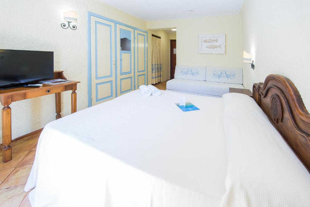 Postel nebo postele na pokoji v ubytování Hotel Colonna San Marco