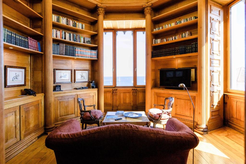 a living room with a couch and a table at The Albatroz Hotel in Cascais