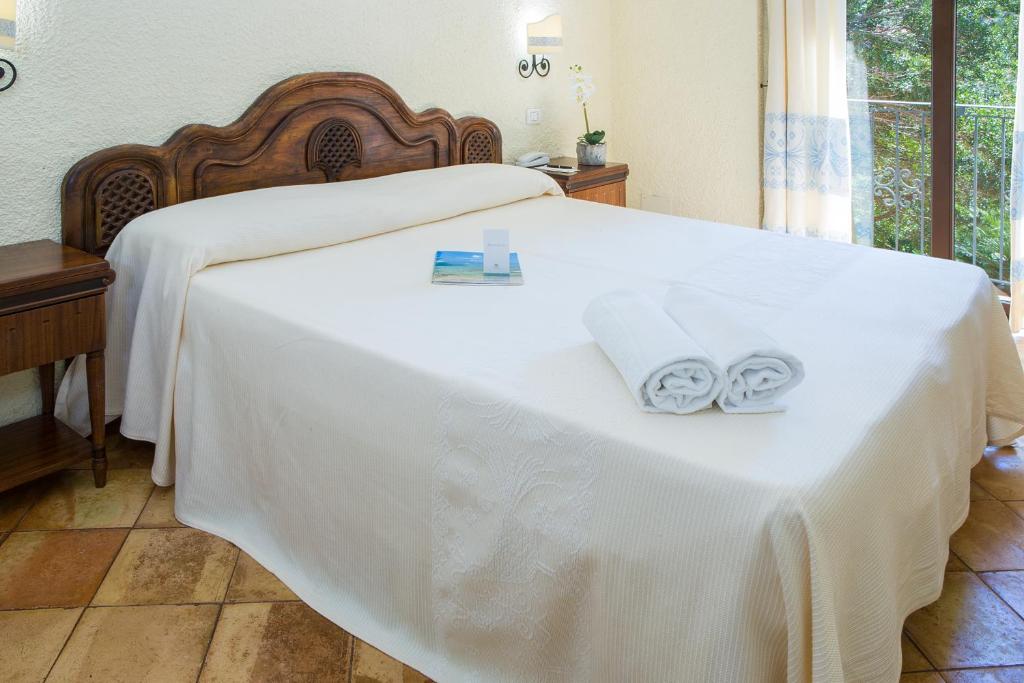 Postel nebo postele na pokoji v ubytování Hotel Colonna San Marco