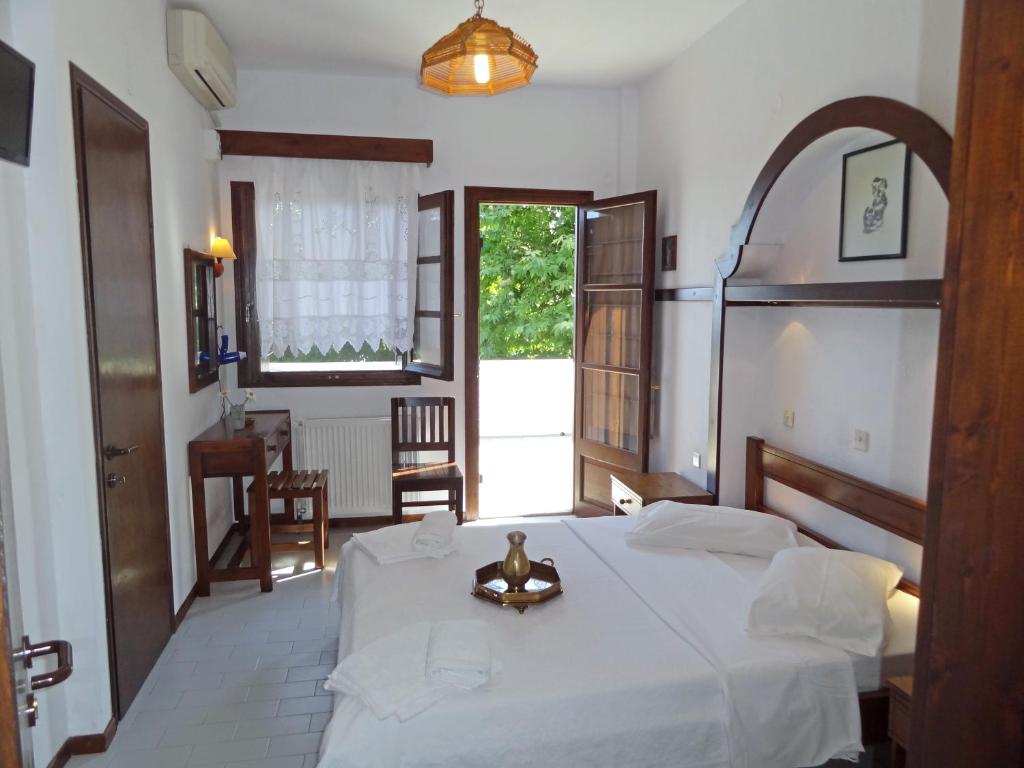 Postel nebo postele na pokoji v ubytování Hotel Vrionis