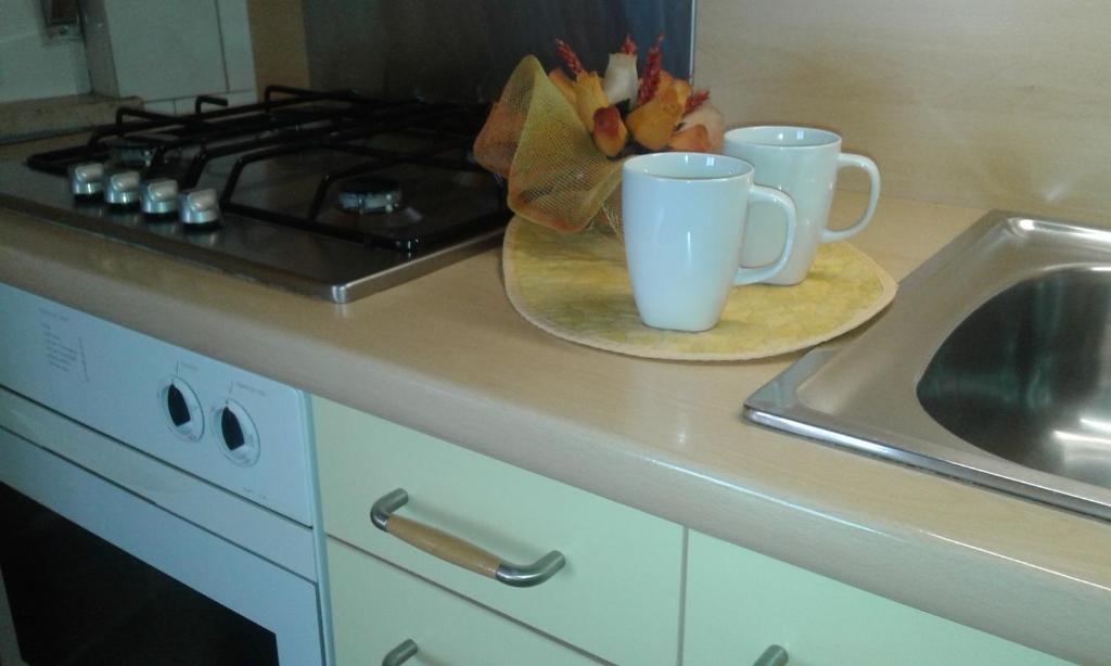 A kitchen or kitchenette at Appartamento Lauretta