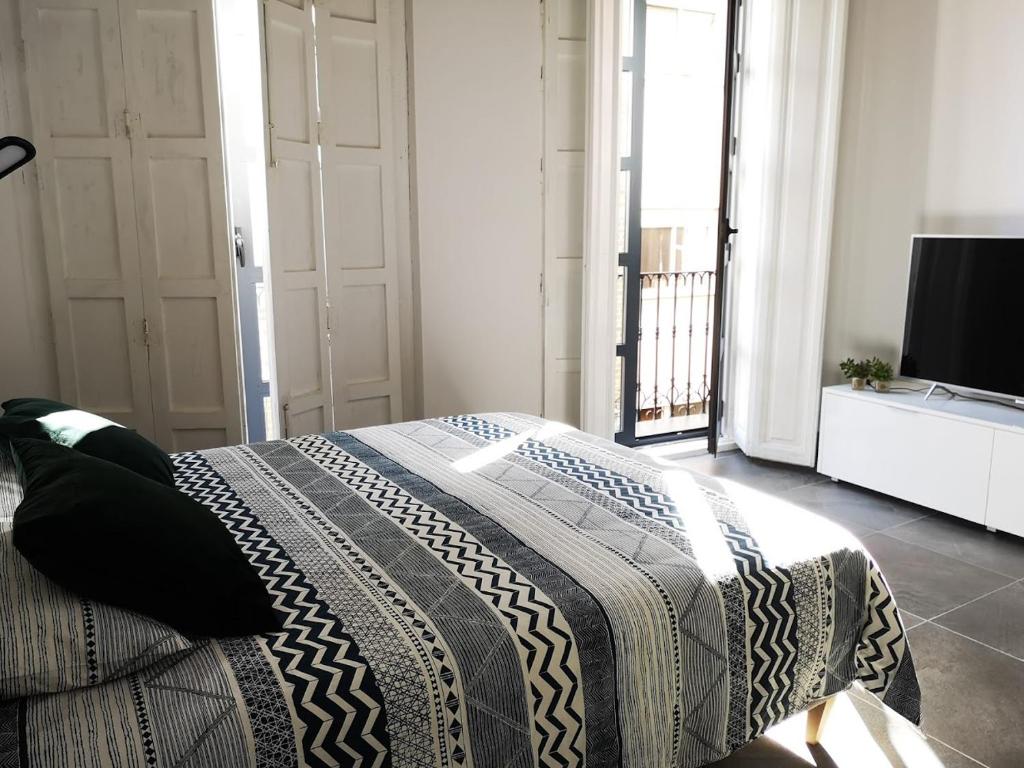 מיטה או מיטות בחדר ב-Historic Suites 21