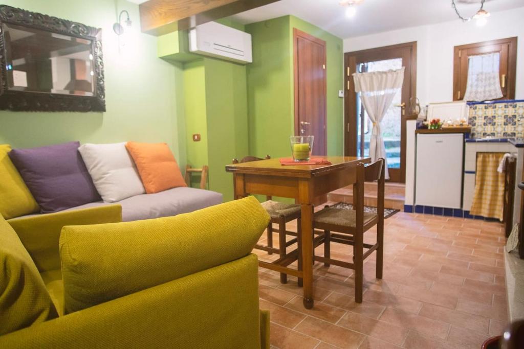 a living room with a couch and a table at Casa di Marina-Trevi in Trevi nel Lazio