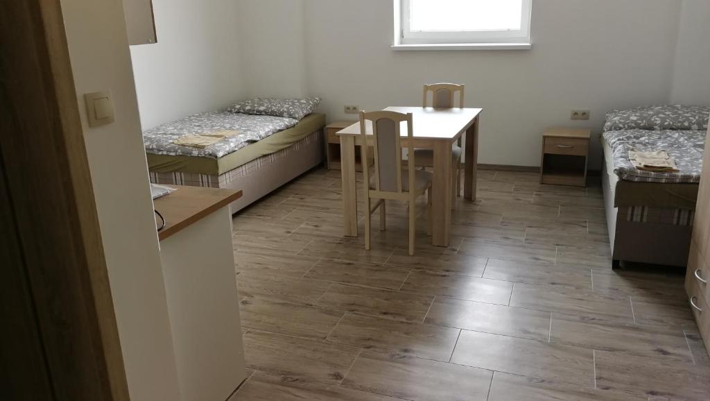 Postel nebo postele na pokoji v ubytování Apartmánové ubytovanie VKF