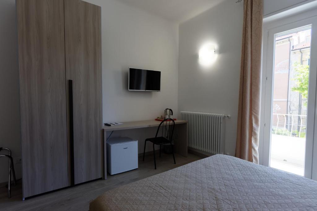 Postel nebo postele na pokoji v ubytování Le Coccole
