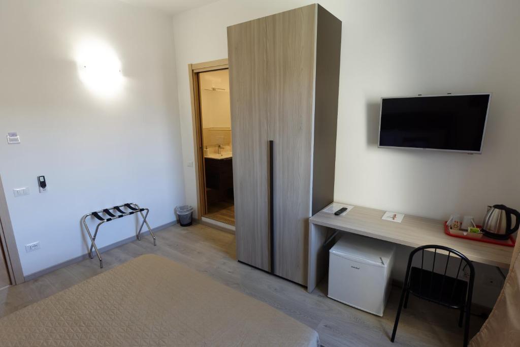 Postel nebo postele na pokoji v ubytování Le Coccole