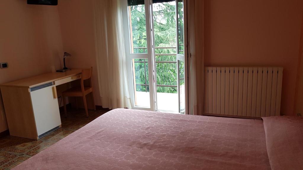 Postel nebo postele na pokoji v ubytování La Collina