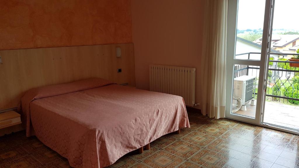 Postel nebo postele na pokoji v ubytování La Collina