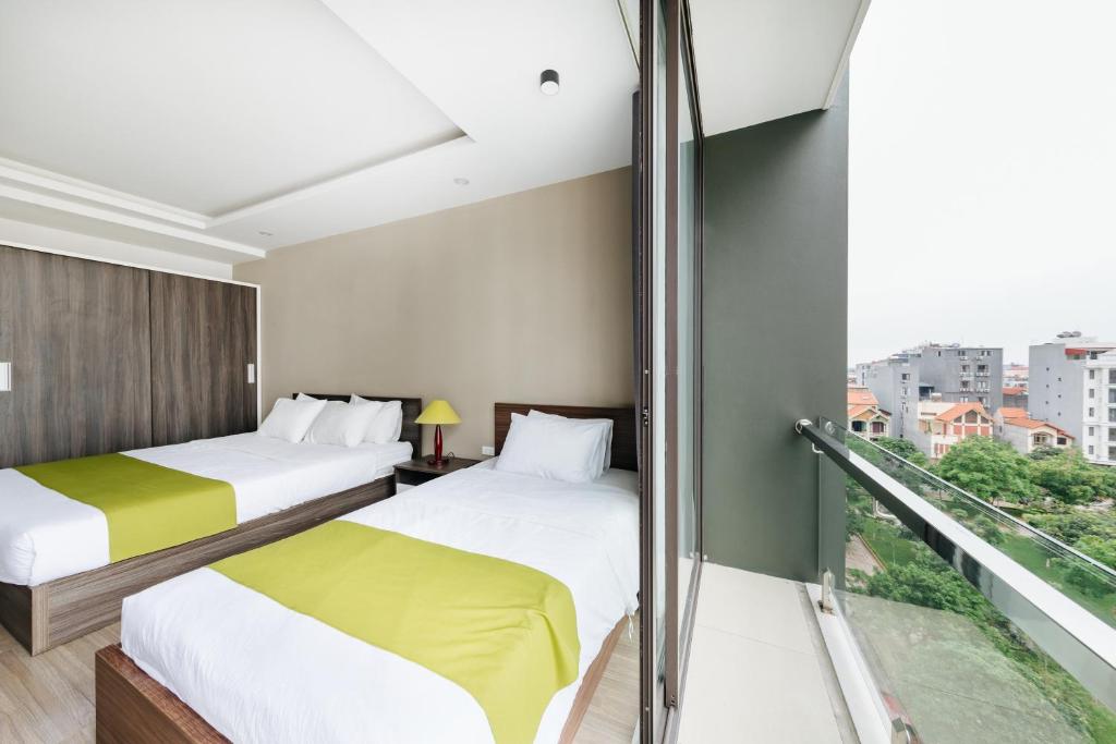 Postel nebo postele na pokoji v ubytování Hana 2 Apartment & Hotel Bac Ninh