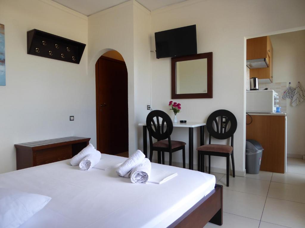 A bed or beds in a room at The Sea View Apartments