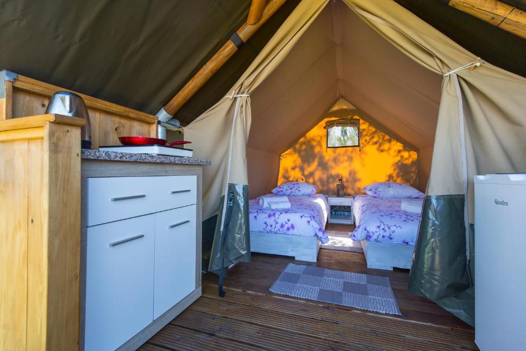 a room with two beds in a tent at Kamp Romantik - glamping in Labin