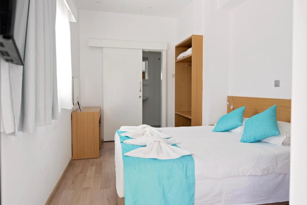 Postel nebo postele na pokoji v ubytování Pyramos Hotel