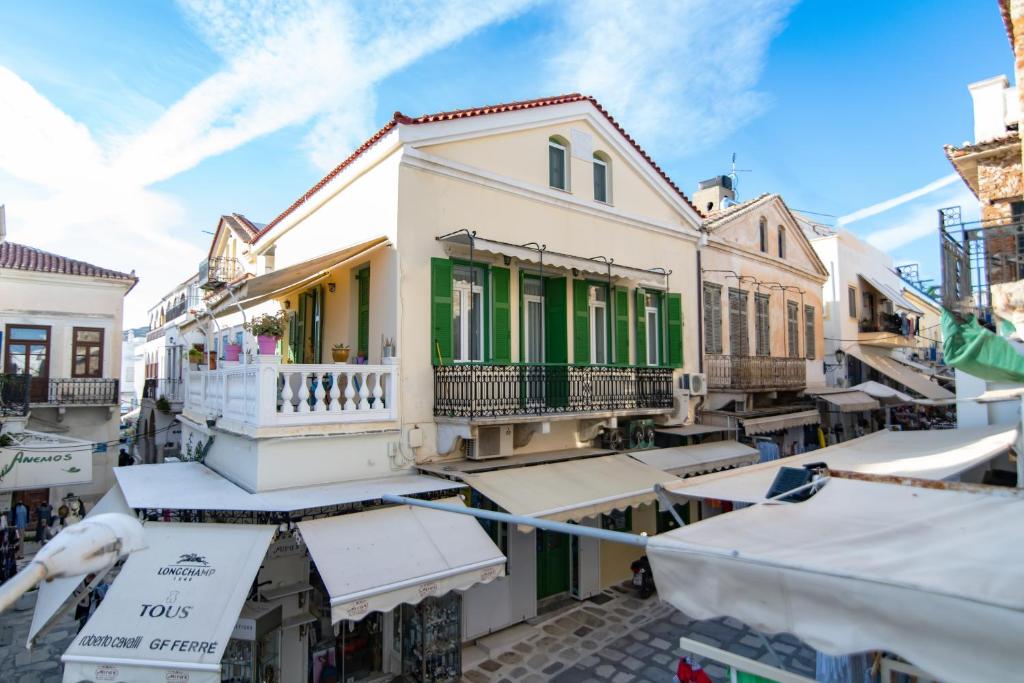 a group of houses in a street with buildings at Tinos La belle vie in Tinos Town