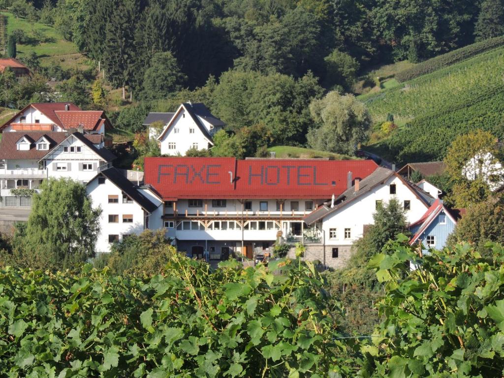 a hotel with a fire hotel written on it in a village at Hotel Faxe Schwarzwälder Hof in Kappelrodeck