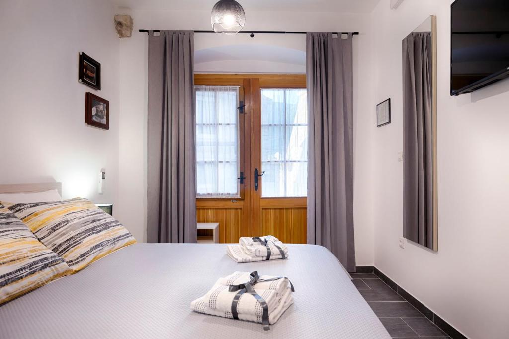 Postel nebo postele na pokoji v ubytování En Suite Room Demaria