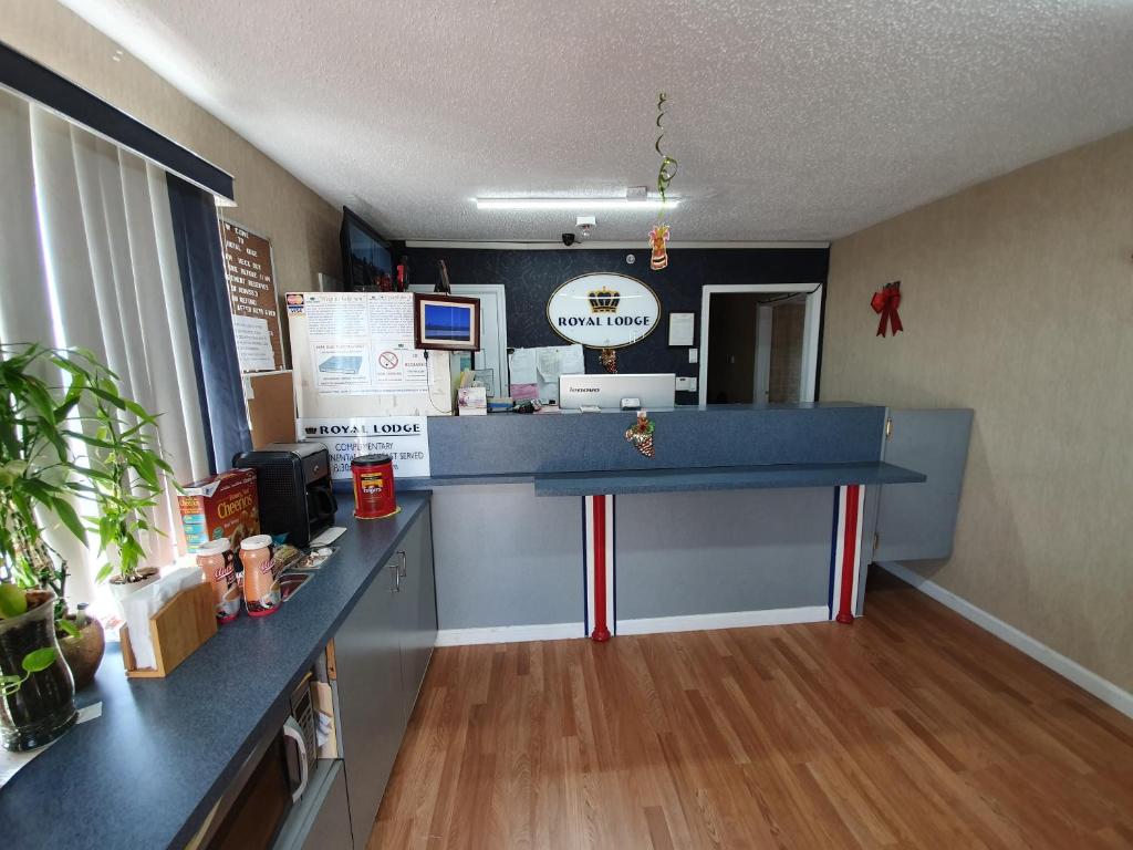 a restaurant counter with a blue counter top in a room at Royal Lodge in Absecon