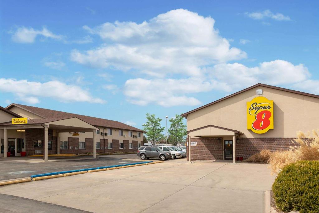 a store with a sign on the side of a building at Super 8 by Wyndham North Platte in North Platte