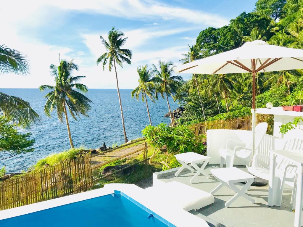 a view of the ocean from the patio of a villa at Bintana Sa Paraiso in Mambajao