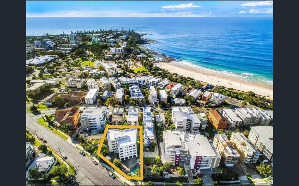an aerial view of a city and the beach at Kings Beach Retreat in Caloundra