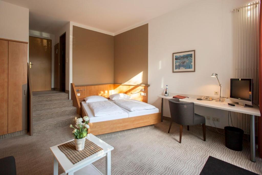 Postel nebo postele na pokoji v ubytování Hotel Spree-idyll