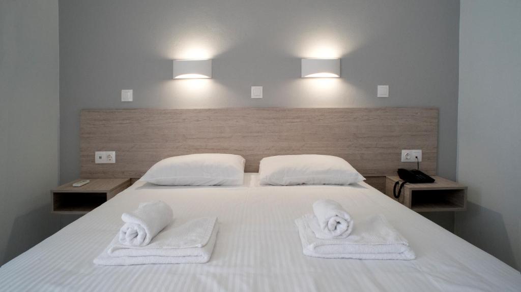 Posteľ alebo postele v izbe v ubytovaní Domenica Apartments