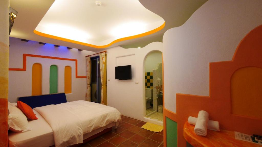Postel nebo postele na pokoji v ubytování Long Yuan Ju Homestay