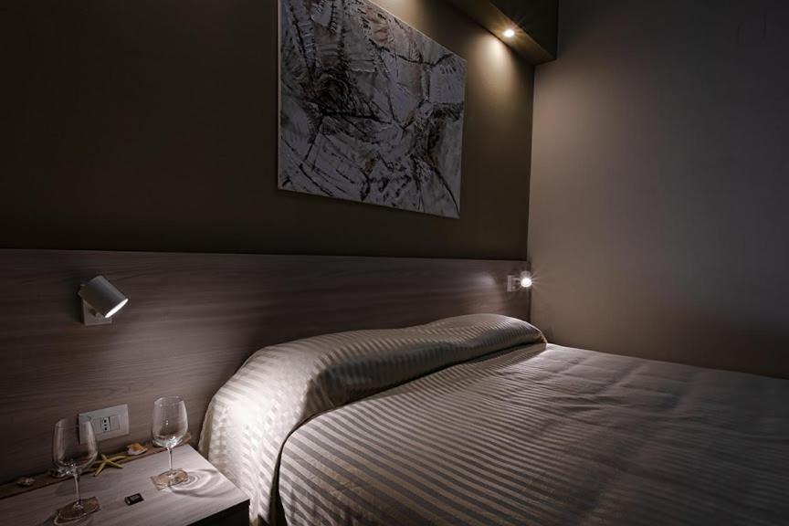 Postel nebo postele na pokoji v ubytování Hotel Scacciapensieri