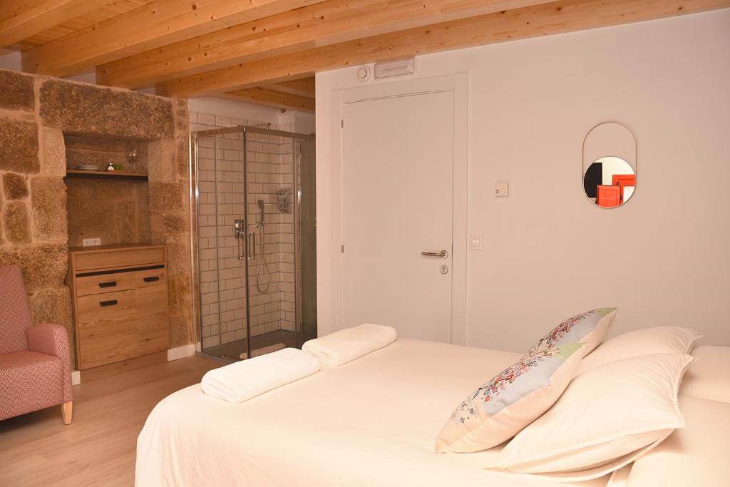 Postel nebo postele na pokoji v ubytování Casa Choupas