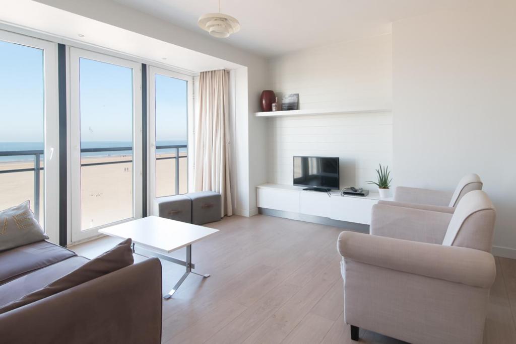 a living room with a view of the ocean at Sealover in Ostend