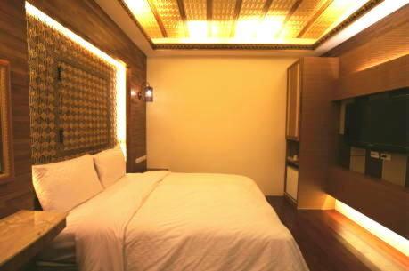 Letto o letti in una camera di Xiu Feng