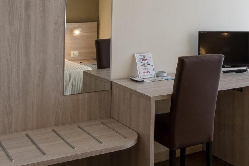 TV a/nebo společenská místnost v ubytování Hotel Scacciapensieri