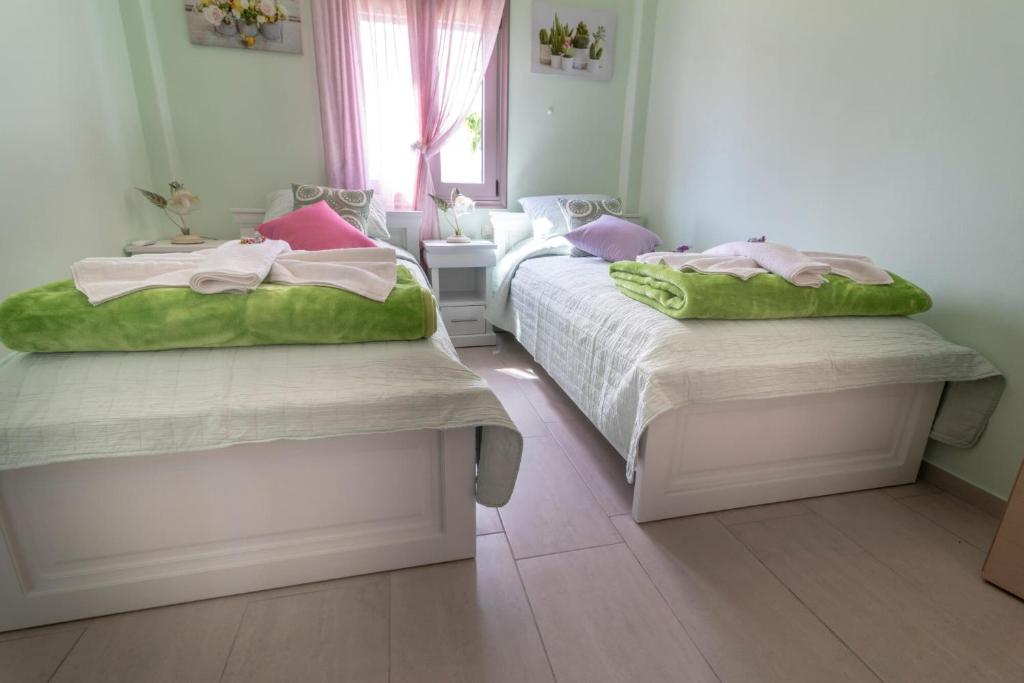 Postel nebo postele na pokoji v ubytování Villa Jodi