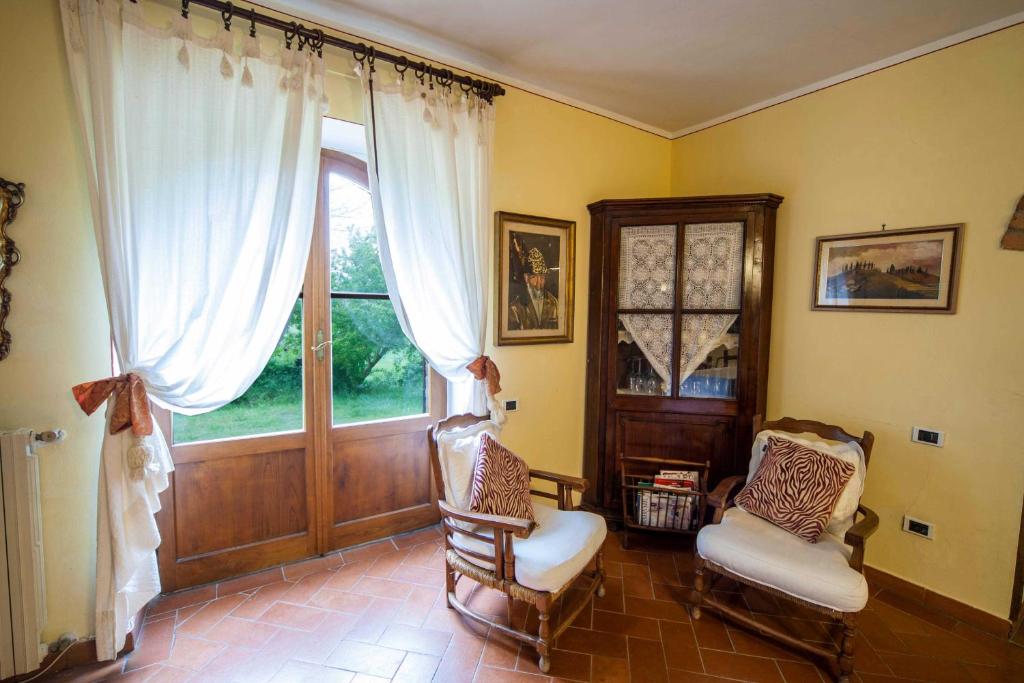 Postel nebo postele na pokoji v ubytování Podere Sionne