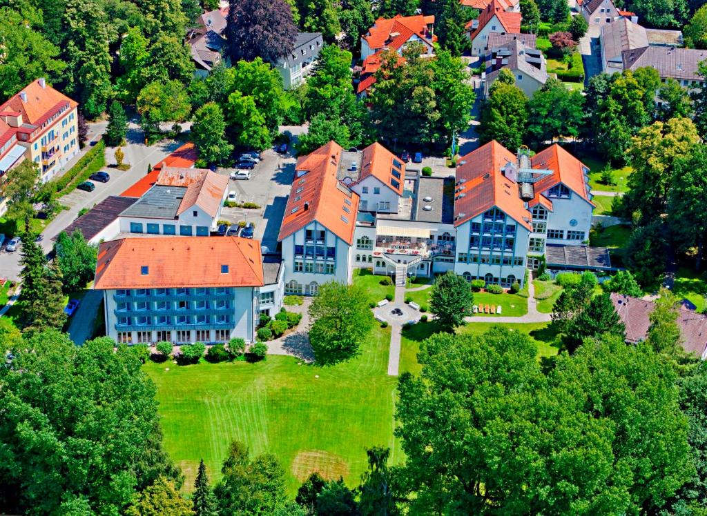 an aerial view of a large building with orange roofs at Hotel Sonnengarten in Bad Wörishofen