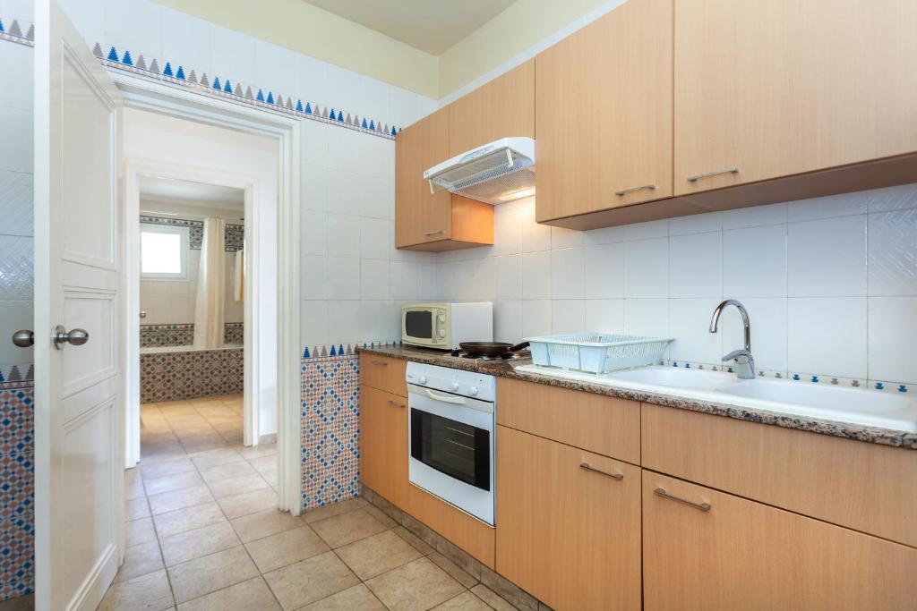 Kuchyň nebo kuchyňský kout v ubytování Le Corail Appart'Hotel Yasmine Hammamet