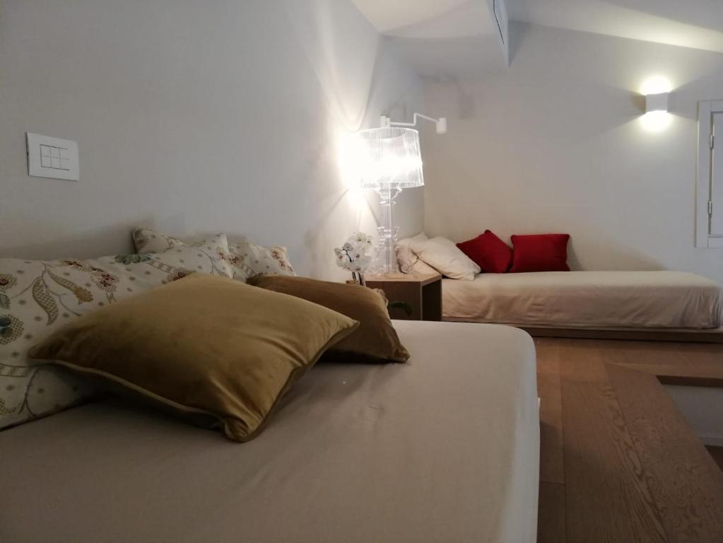 Postel nebo postele na pokoji v ubytování Agriturismo Le Piccole Macìe