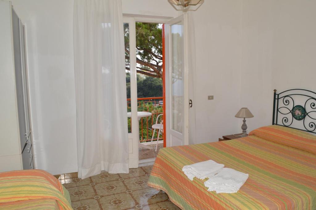 Postel nebo postele na pokoji v ubytování Hotel Polito