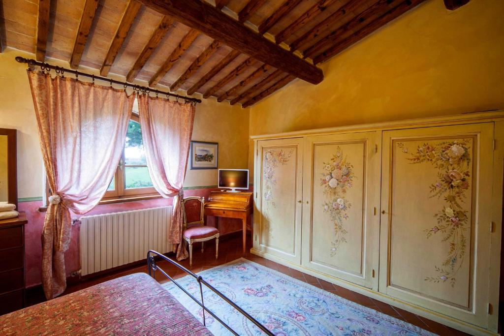 Postel nebo postele na pokoji v ubytování Podere Sionne