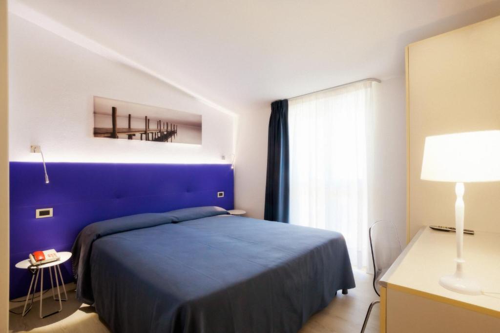 Postel nebo postele na pokoji v ubytování Hotel Savoy