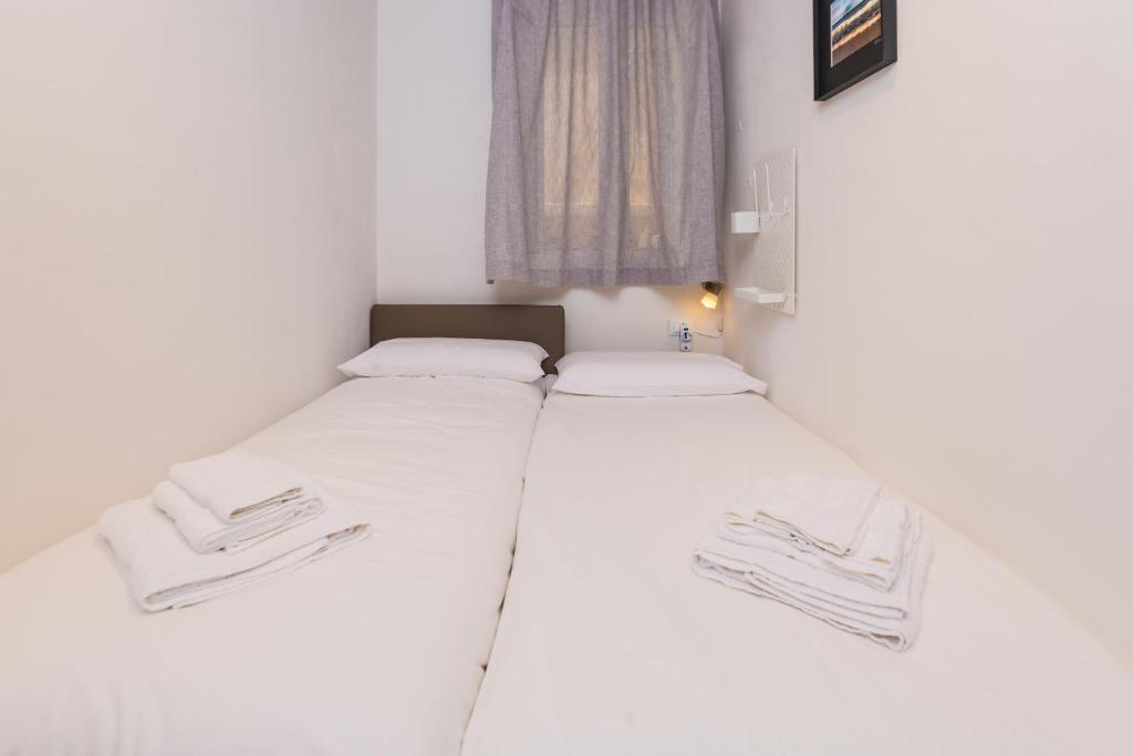Łóżko lub łóżka w pokoju w obiekcie Mosina Apartments