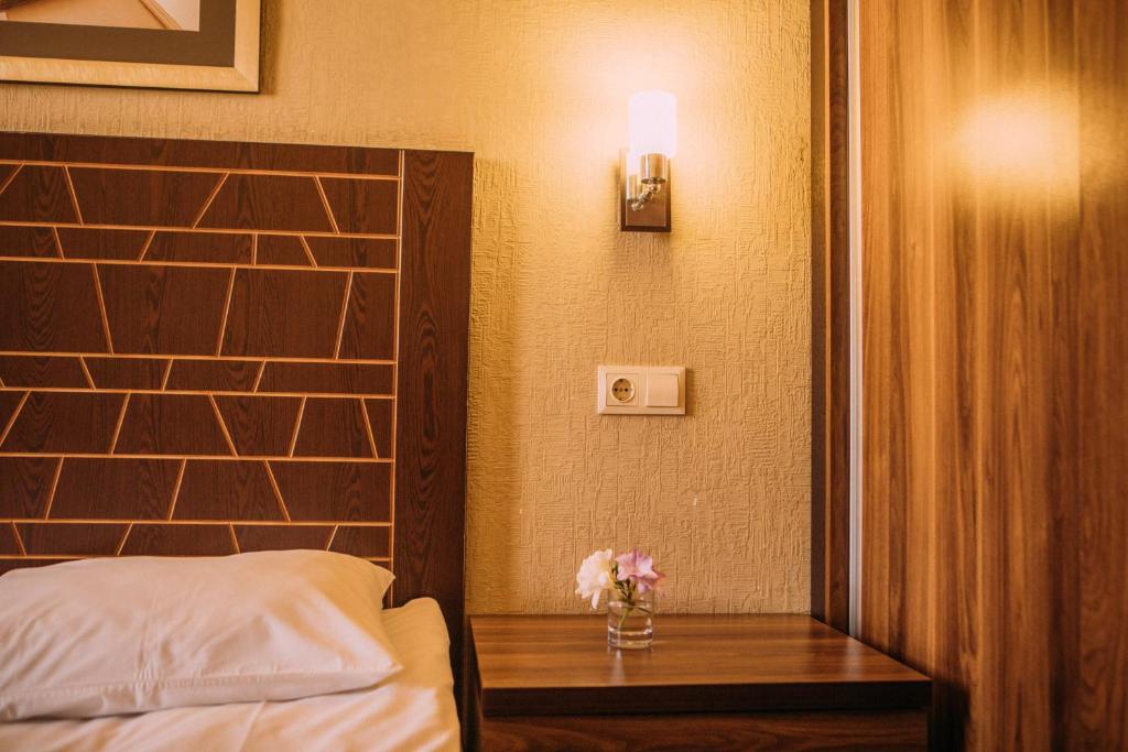 Postel nebo postele na pokoji v ubytování Kantar Hotel