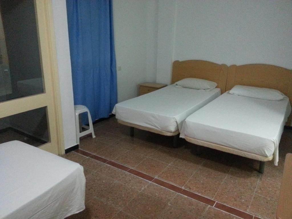 Postel nebo postele na pokoji v ubytování Hostal Casa de Huéspedes San Fernando - Adults Only