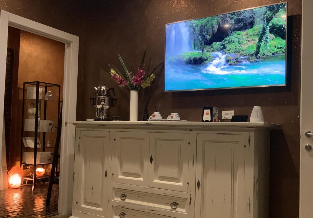 TV a/nebo společenská místnost v ubytování Ricaroka Hotel