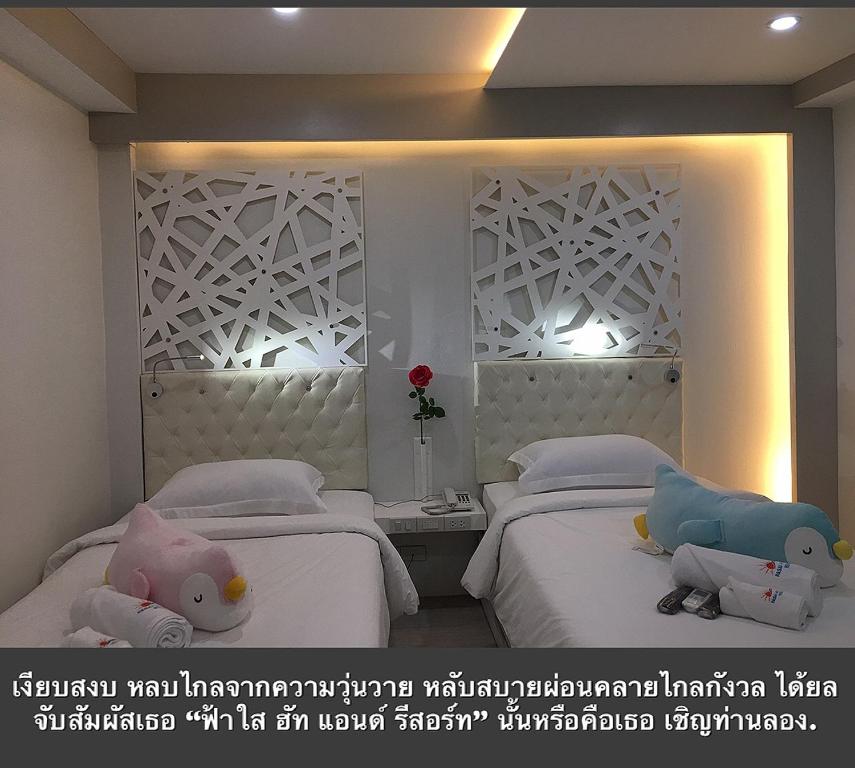 Postel nebo postele na pokoji v ubytování Fasai hut and resort